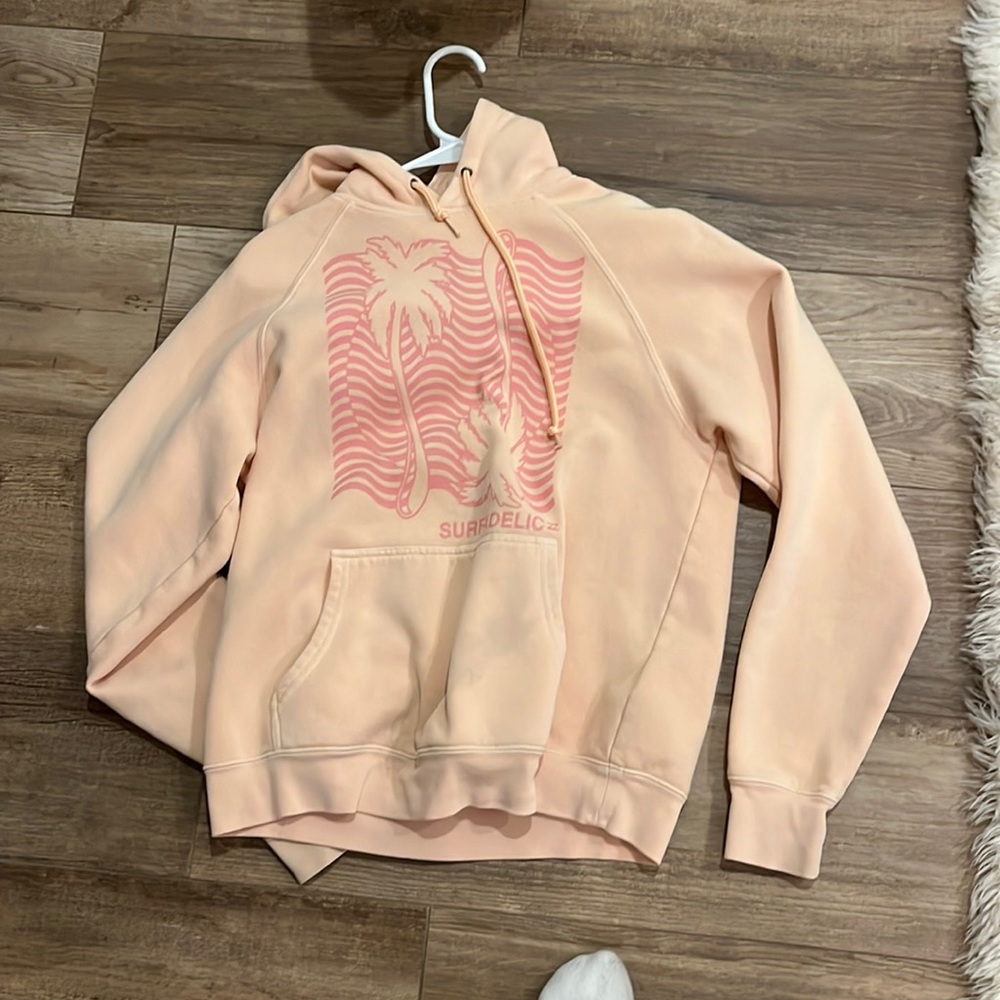 woman’s pink hoodie